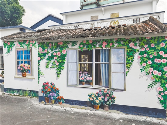 在古劳镇大埠村,精美墙绘与周边环境巧妙融合。 在古劳镇大埠村,精美墙绘与周边环境巧妙融合。