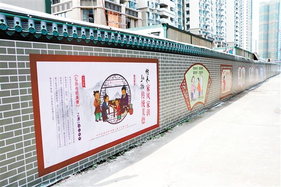 礼乐中福社区的红砖墙"摇身一变",成为一面公益广告文化墙.